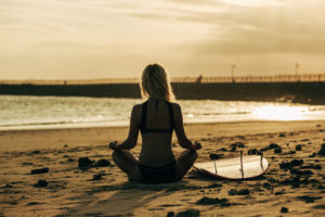 Meditating before surfing