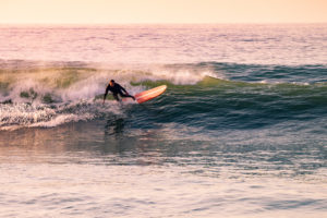 Longboard Surfing in the Sunset